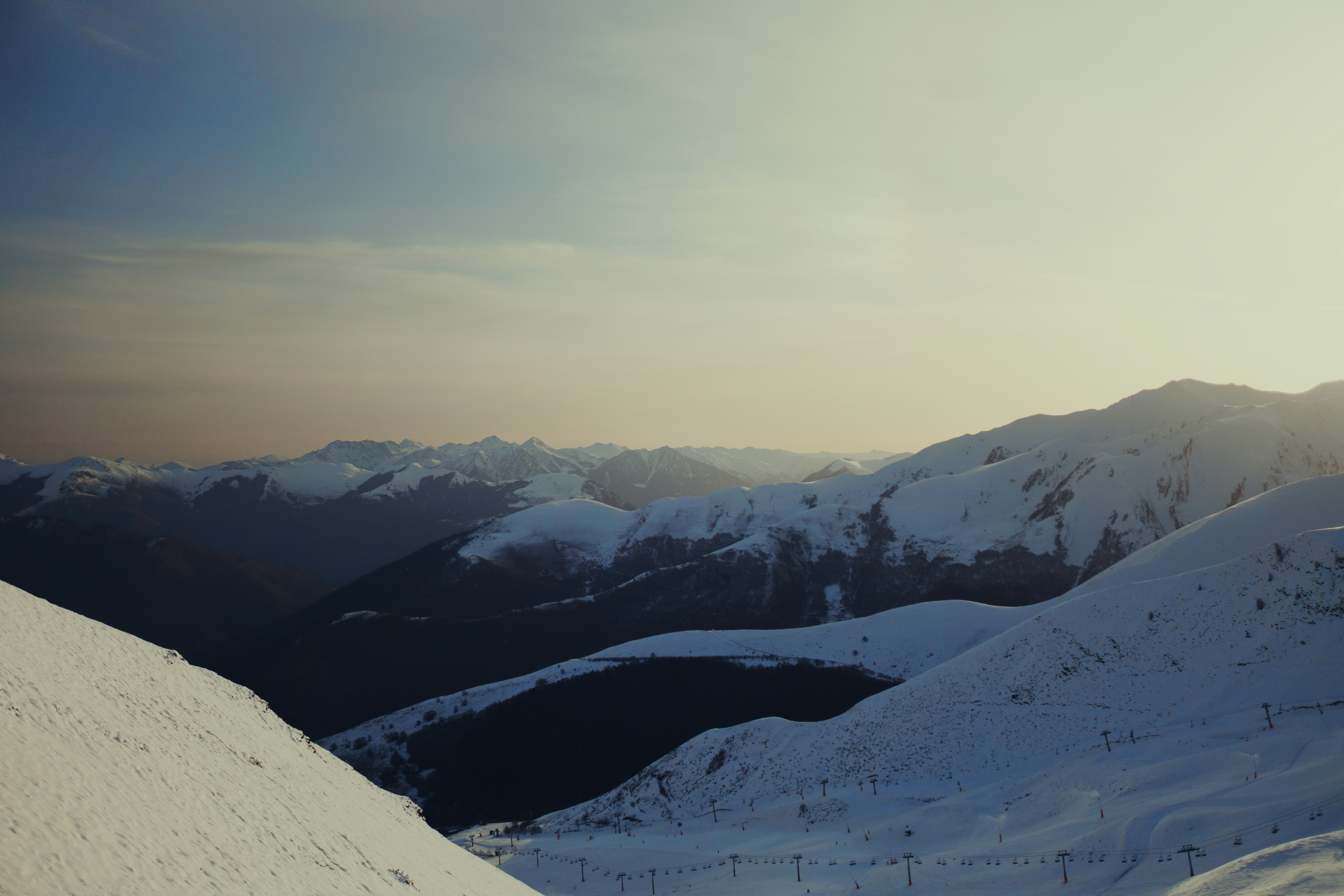 snow covered mountain under white sky during daytime